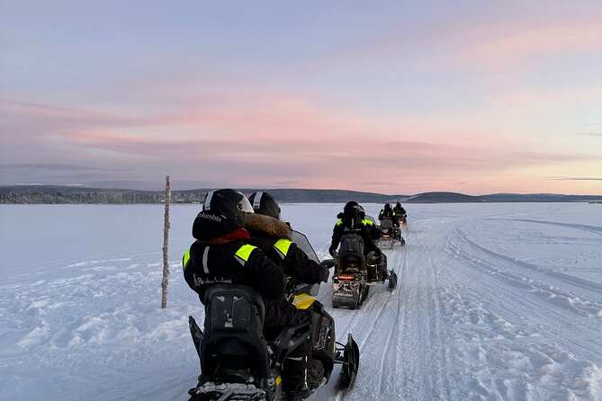 Day tour with snowmobile in Kiruna 10:30 am - A Warm Pause with Lingonberry Juice and Fika