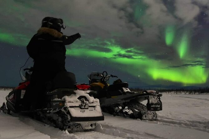 Enjoy the Aurora show on top of the mountain inc tipi dinner - Snowmobiling across Mt. Ednavaara after dark
