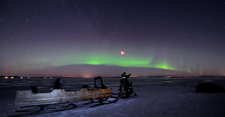 Luleå : Northern Lights Tour on a Snowmobile drawn Sled - Settling into a sled lined with reindeer pelts