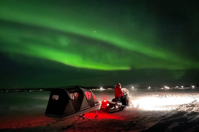 Northern Light snowmobile tour in Kiruna 7:30 pm - Riding through forests and across frozen water
