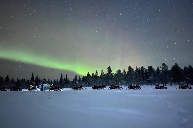 Northern Light snowmobile tour in Kiruna 7:30 pm - Passing the Icehotel beside the Torne River