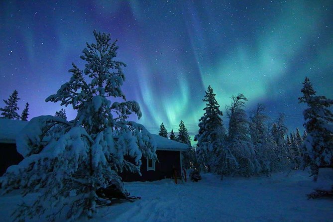 Green aurora over a frozen lake outside Kiruna