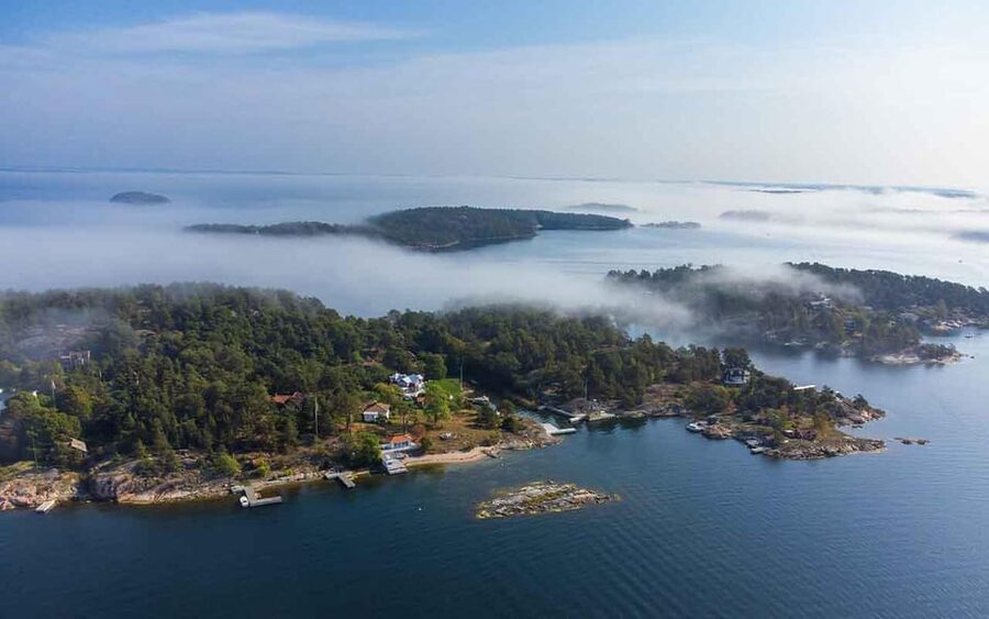 A red cottage on a rock island in the Stockholm archipelago